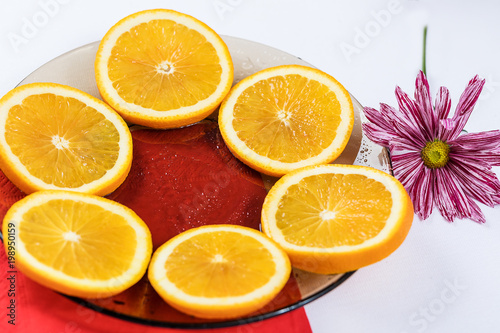 Orange sliced on a plate.