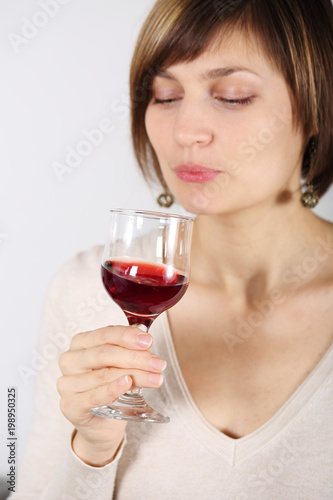 woman tasting wine