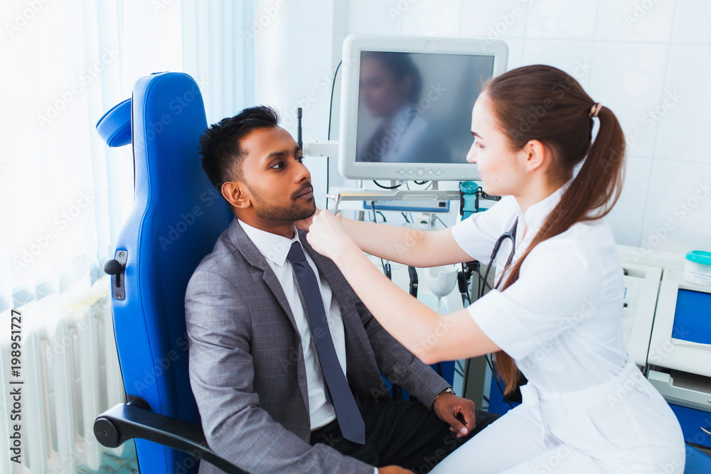 Obraz premium medical checkup. A beautiful female doctor holds the Asian patient's hand for encouragement and sympathy and touching her hand. concept of partnership, trust and medical ethics. Bad news and support.