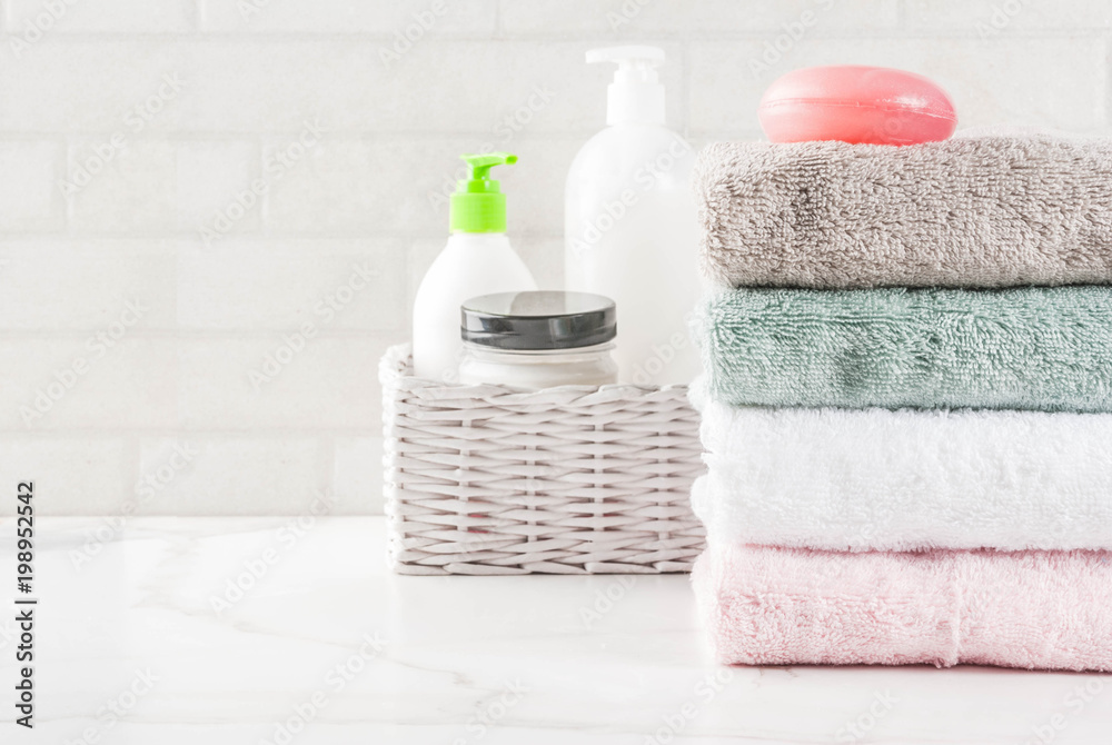Spa relax and bath concept, sea salt, soap, with cosmetics and towels in bathroom white background, copy space top view Spa relax and bath concept, sea salt, soap, with cosmetics and towels in bathroom white background, copy space top view