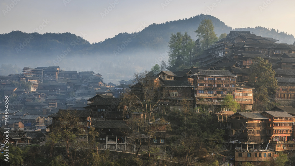 Xijiang Qianhu Miao Village in Guizhou, China at sunrise
