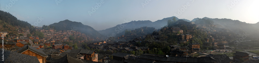 Panoramic view of Xijiang Qianhu Miao Village in Guizhou, China at sunrise