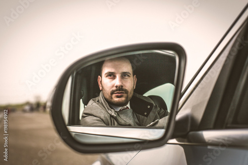 Man in his car. © Mladen