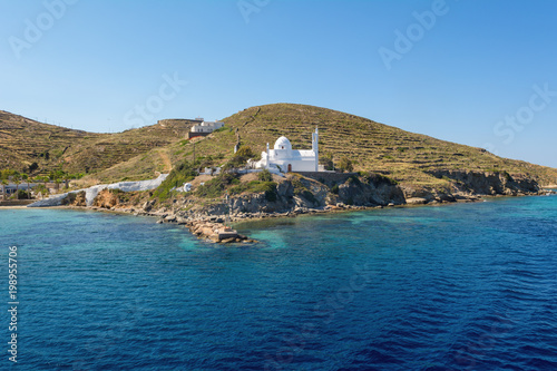 Traditional whitewashed Greek church on the shore of Ios island. Greece.