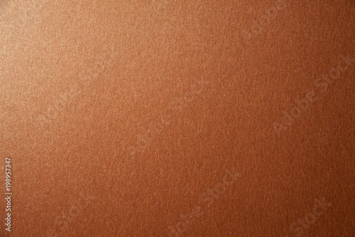 Texture of bronze brown glitter paper background. Macro photo