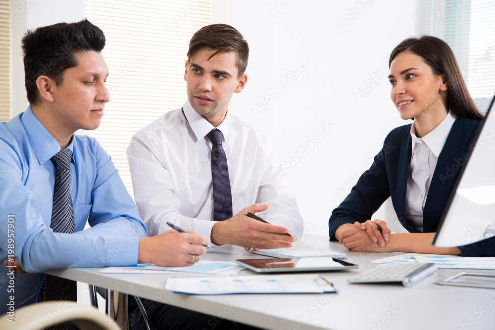 Businessman tells his colleagues about a new project Businessman tells his colleagues about a new project