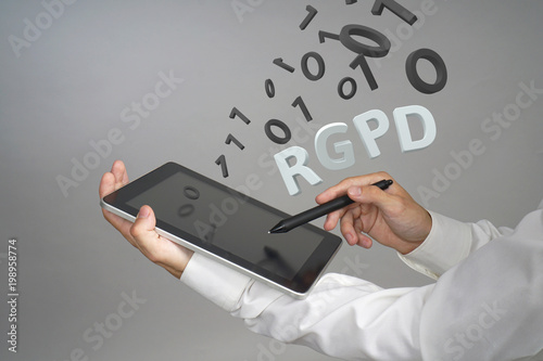 RGPD, Spanish, French and Italian version version of GDPR: Reglamento General de Proteccion de datos. General Data Protection Regulation. Young man working with information. photo