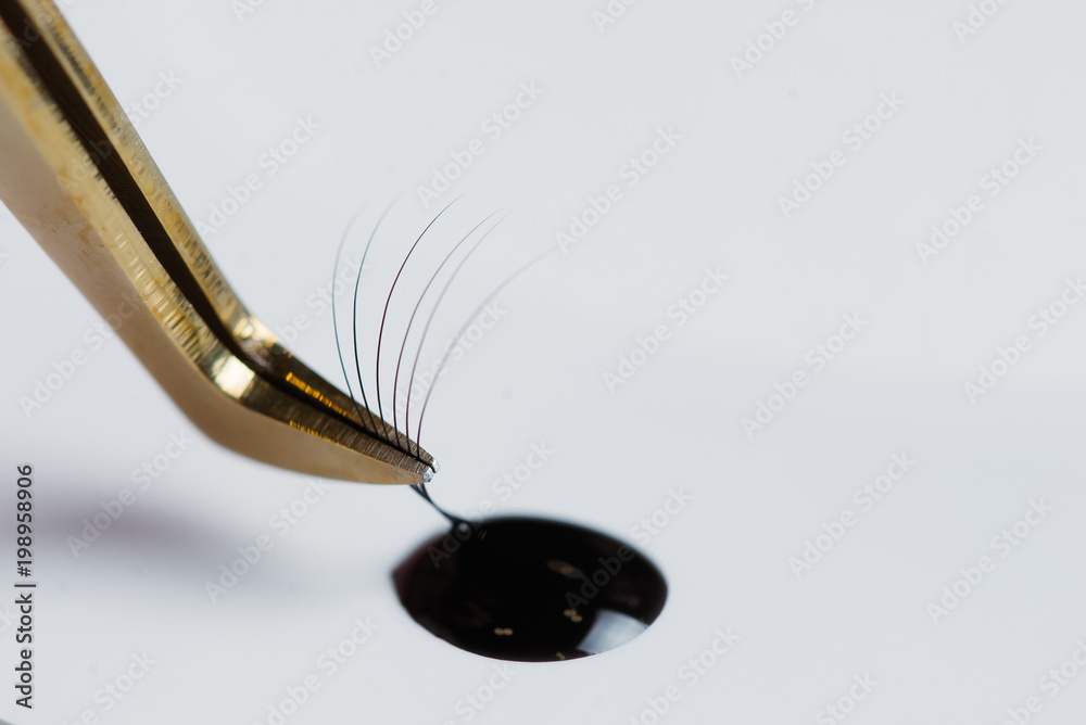 Fototapeta premium Eyelash Extension tools on white background. Accessories for eyelash extensions. Artificial lashes.