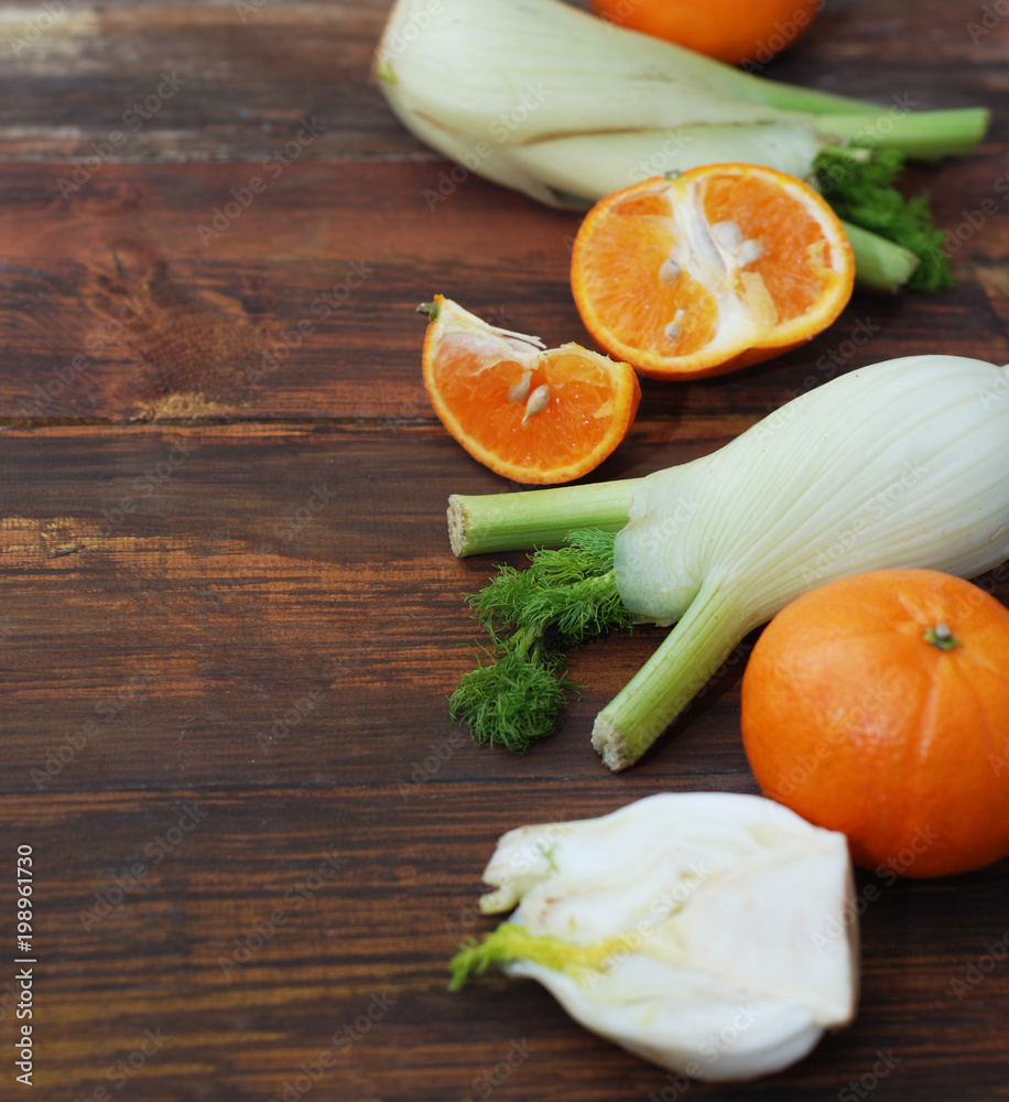 Fennel Vegetable Isolated. Fennel and Orange Citrus Fruit over Wooden Background. Healthy Vegetarian Food. Fennel Vegetable Isolated. Fennel and Orange Citrus Fruit over Wooden Background. Healthy Vegetarian Food.