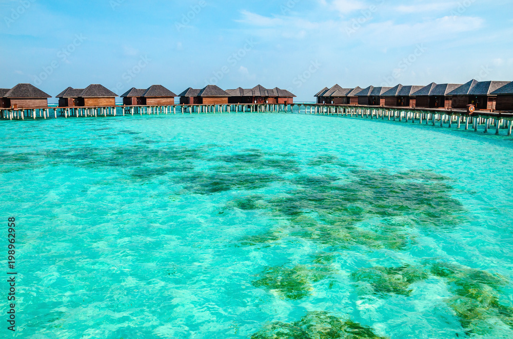 Over water bungalows on a tropical island, Maldives
