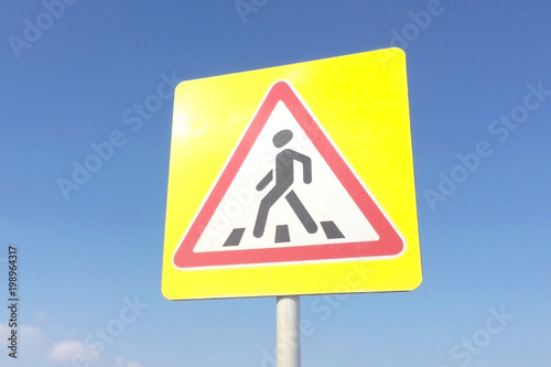 Road sign pedestrian crossing close-up