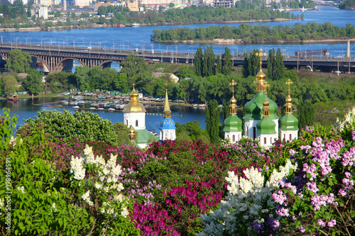 Vydubychi Monastery with lilac blossom in Kyiv, Ukraine photo