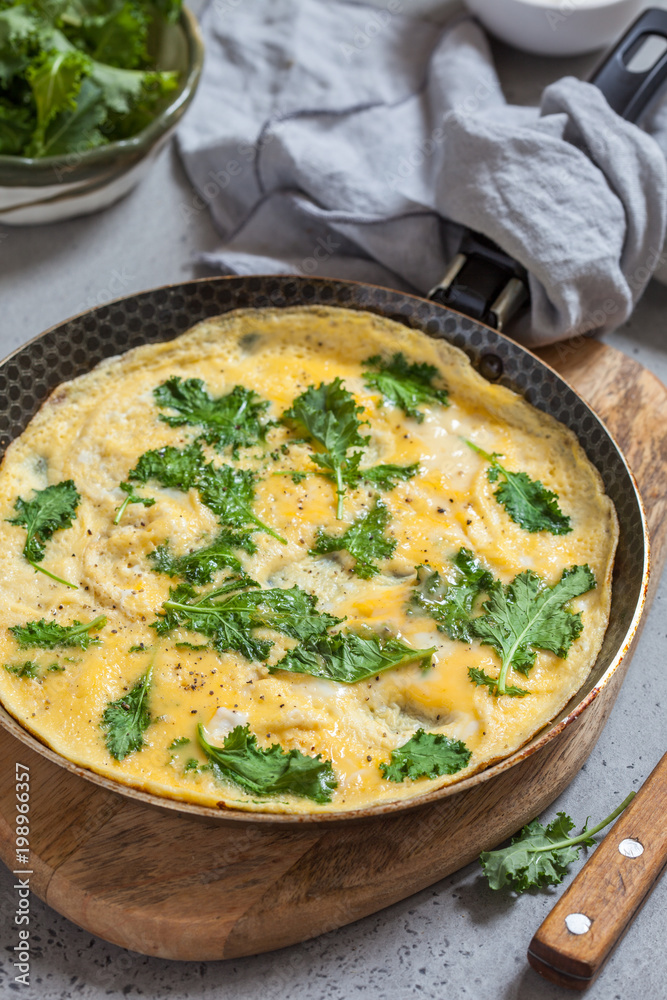 Omelette with baby kale leaves