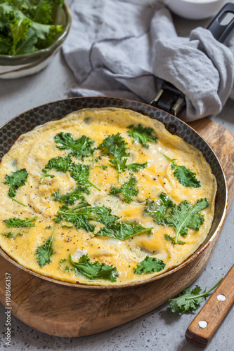 Omelette with baby kale leaves