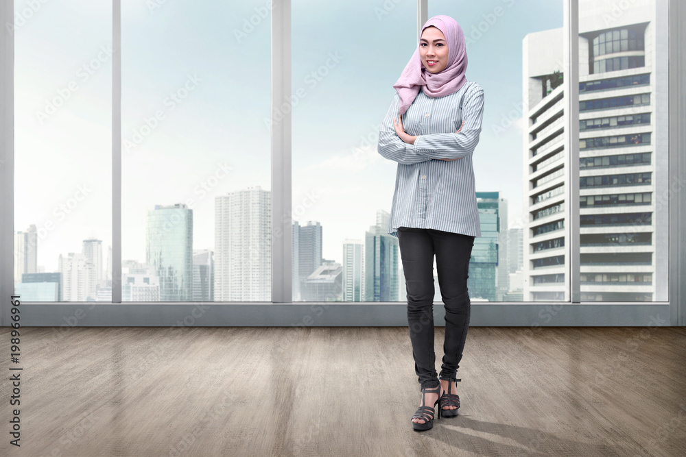 Pretty asian muslim woman in veil with arms crossed Pretty asian muslim woman in veil with arms crossed