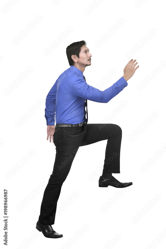 Image of asian businessman posing walking upstairs Image of asian businessman posing walking upstairs