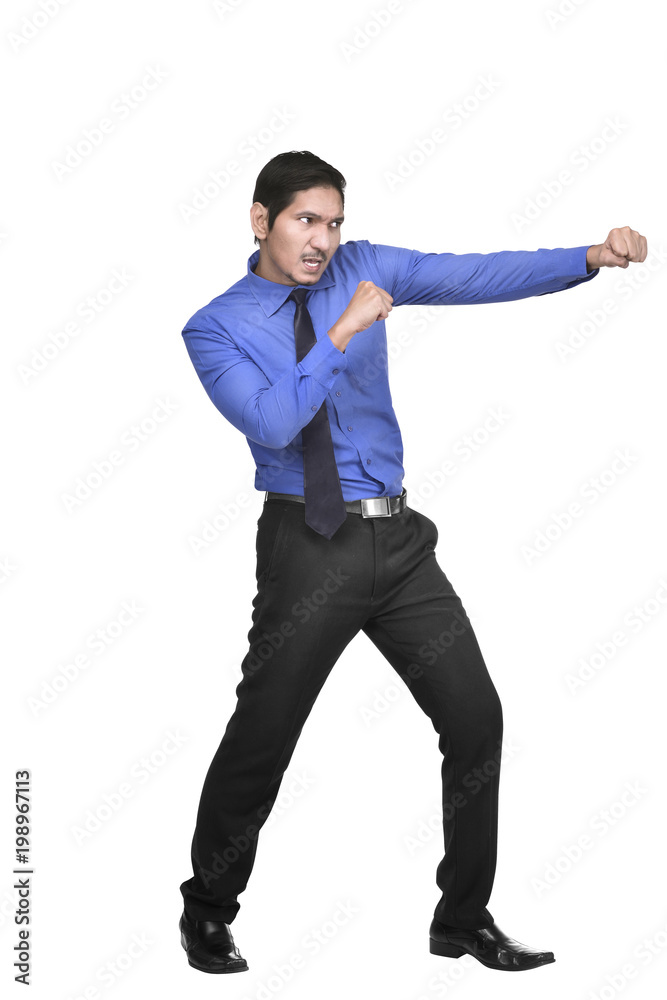 Attractive asian businessman punching something Attractive asian businessman punching something