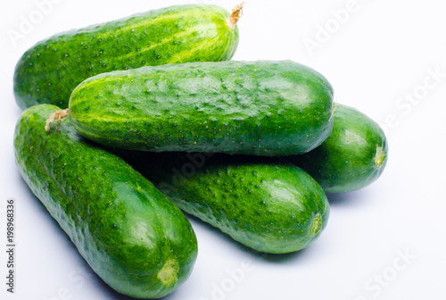 green cucumbers fresh on a white background
