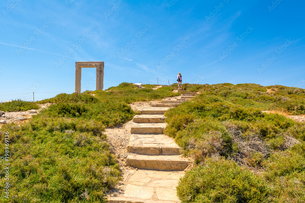 Stairs leading to the Portara, one of Naxos most famous landmarks in Naxos (Chora) town. Cyclades Islands, Greece.