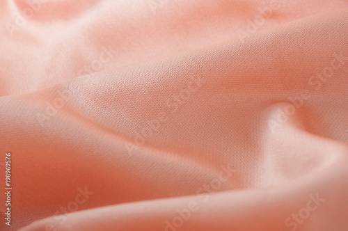 closeup of orange satin fabric background