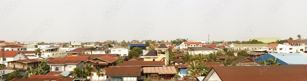 panoramic view of a typical southeast asian town, with temples and iron roofs, Laos, Southeast Asia