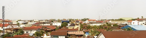 panoramic view of a typical southeast asian town, with temples and iron roofs, Laos, Southeast Asia