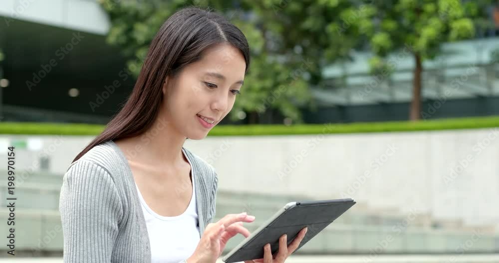 Woman using tablet computer in city Woman using tablet computer in city
