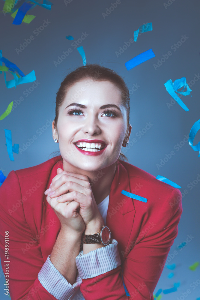 Obraz premium Portreit beautiful happy woman at celebration party with confetti .Birthday or New Year eve celebrating concept.