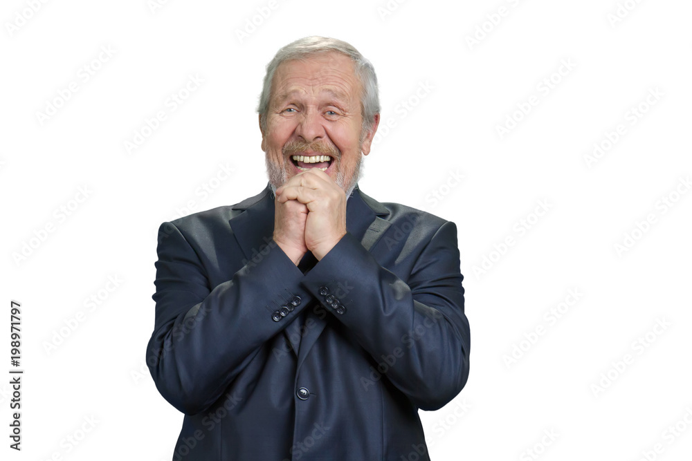 Senior business man laughing hard with folded hands. Dark blue suit. White isolated background. Senior business man laughing hard with folded hands. Dark blue suit. White isolated background.