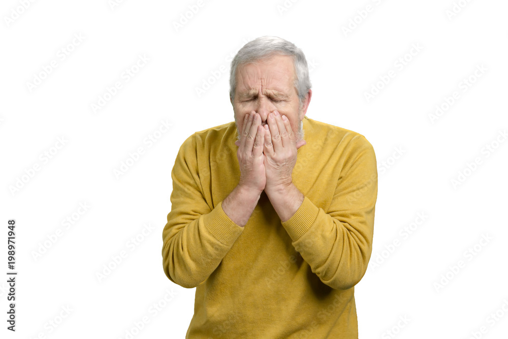 Portrait of senior man coughing. Sick old man in yellow wool sweater. White isolated background. Portrait of senior man coughing. Sick old man in yellow wool sweater. White isolated background.