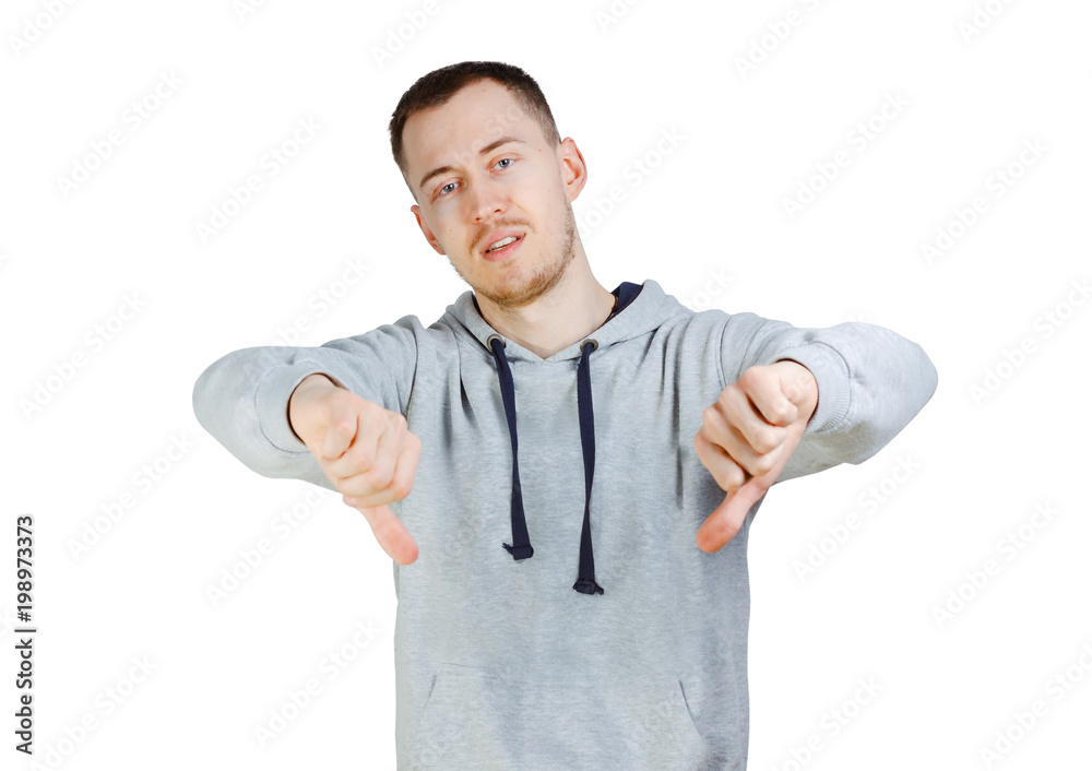 Young man with bristle shows gesture thumbs down.Isolated on a white background. Young man with bristle shows gesture thumbs down.Isolated on a white background.
