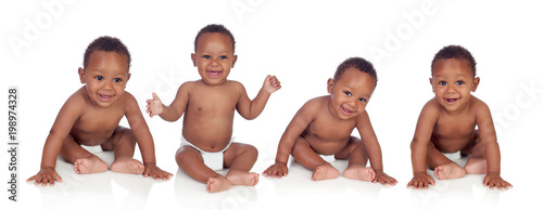 Four funny african baby sitting on the floor