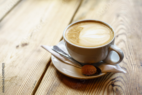 Caffe Latte with wooden background