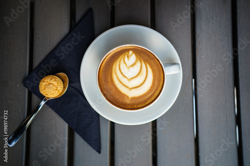 Caffe with Latte Artwith wooden background photo