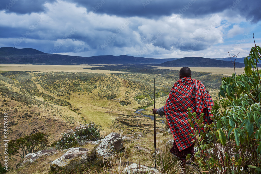 Traditional Masai looking over crater