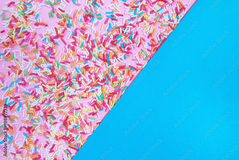 Colorful Confetti in front of blue pink Background