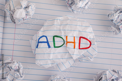 ADHD. Abbreviation ADHD on crumpled paper ball