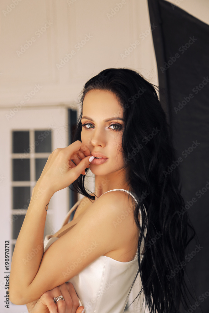 sexy beautiful woman with dark hair and evening makeup, in elegant clothes sexy beautiful woman with dark hair and evening makeup, in elegant clothes