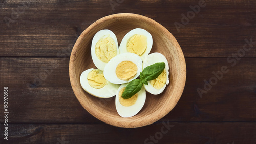 tasty boiled eggs over rustic background