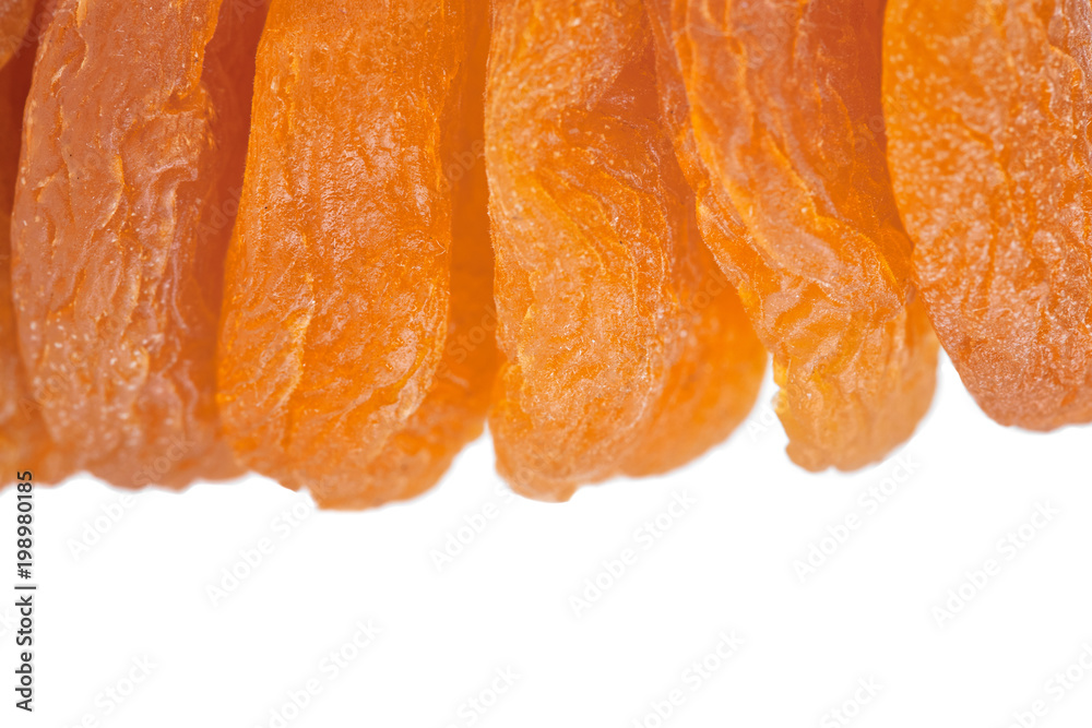 Dried apricot ingredient close up isolated on a white background. One orange apricot fruit with clipping path photo for advertising Dried apricot ingredient close up isolated on a white background. One orange apricot fruit with clipping path photo for advertising