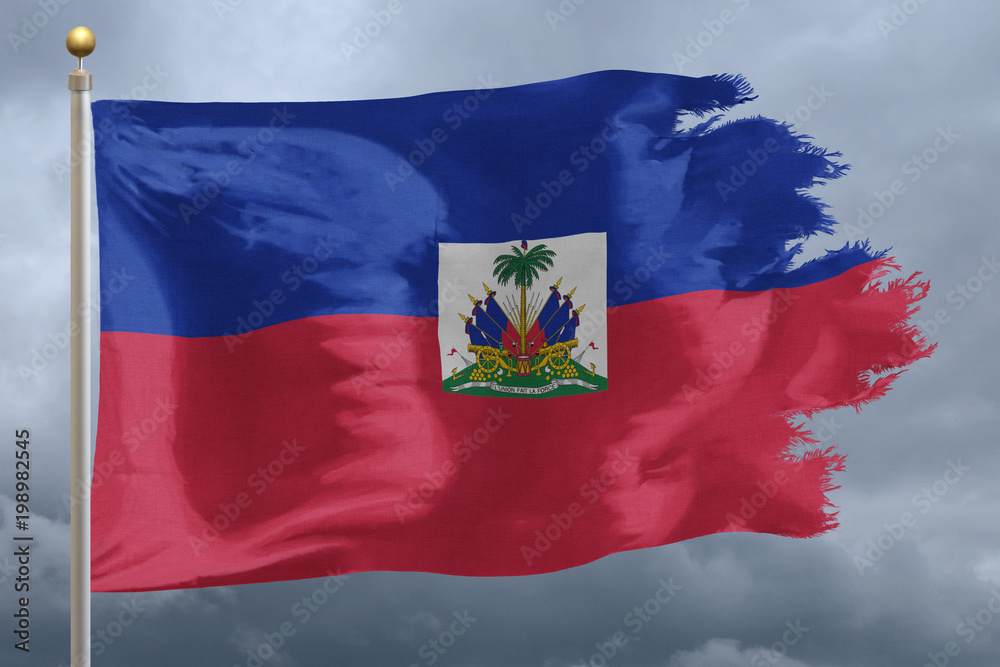 Haiti Flag with torn edges in front of a stormy sky Haiti Flag with torn edges in front of a stormy sky