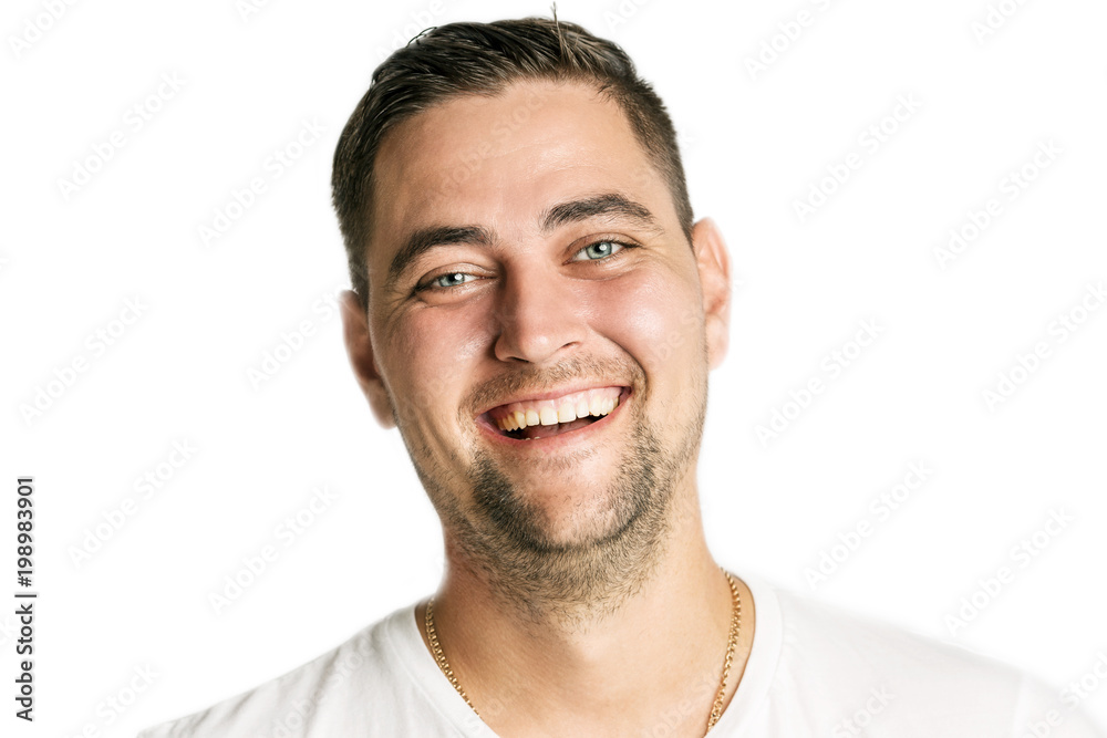 Handsome young man laughing, close-up, isolated