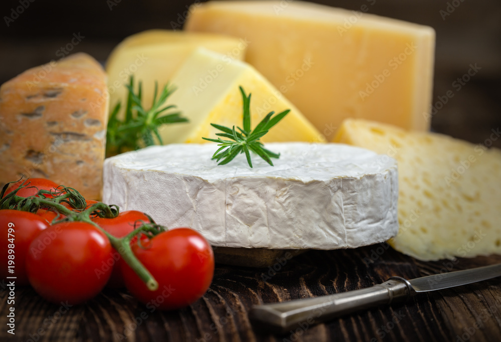 Cheeses with basil, rosemary and tomatoes.