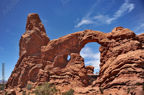 USA. Natural arch of red stone in Utah