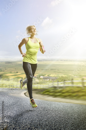 young fitness woman runner running on sunrise village trail