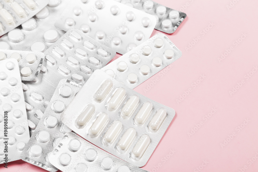 Various medicine pills on pink background. Copy space Various medicine pills on pink background. Copy space