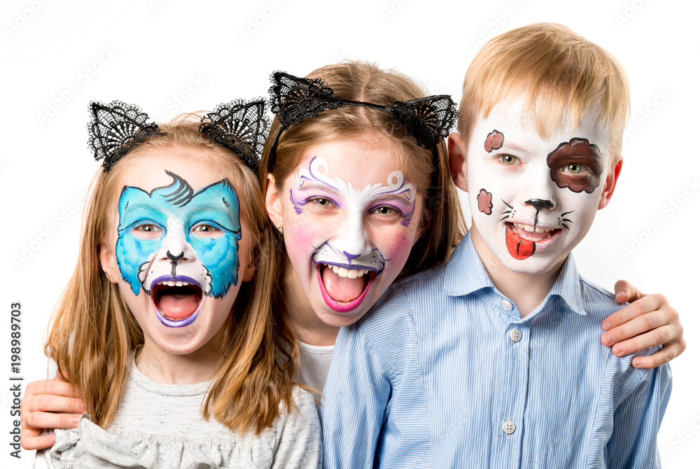 Children with animal face paintings isolated