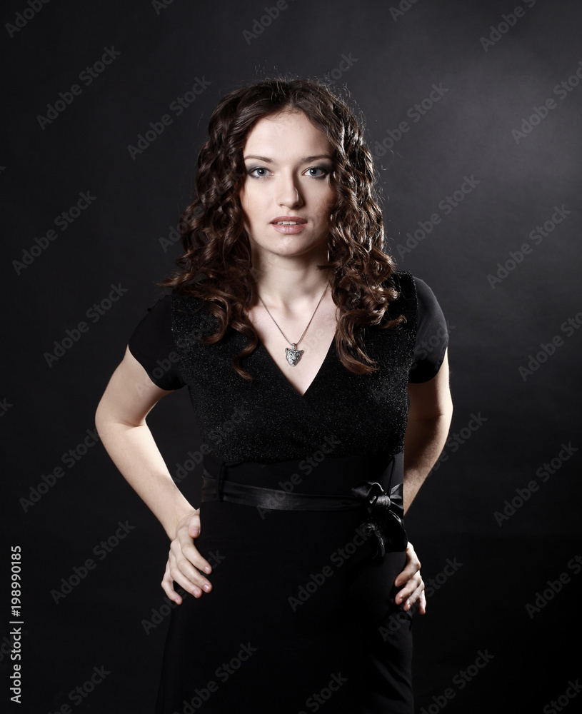 closeup of beautiful young woman in evening black dress closeup of beautiful young woman in evening black dress