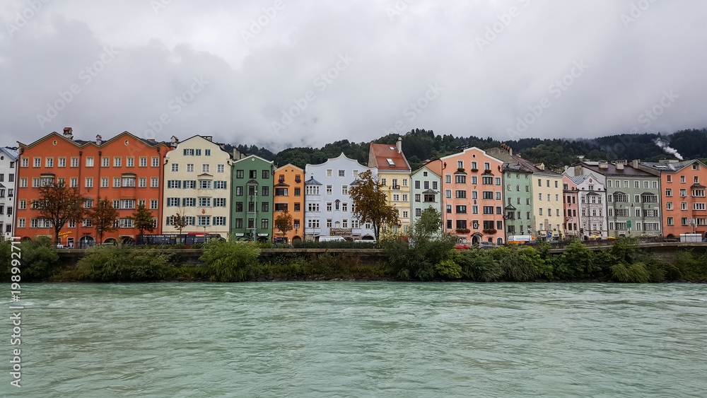 Innsbruck, Tirol/Austria - September 19 2017: Colored houses on the river bank of the Inn
