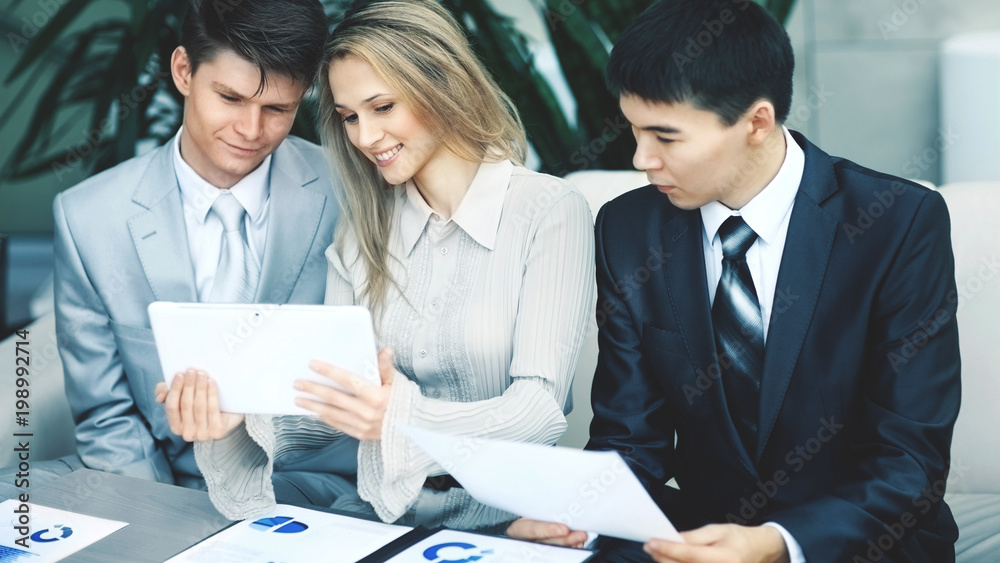 friendly and successful business team working in office friendly and successful business team working in office